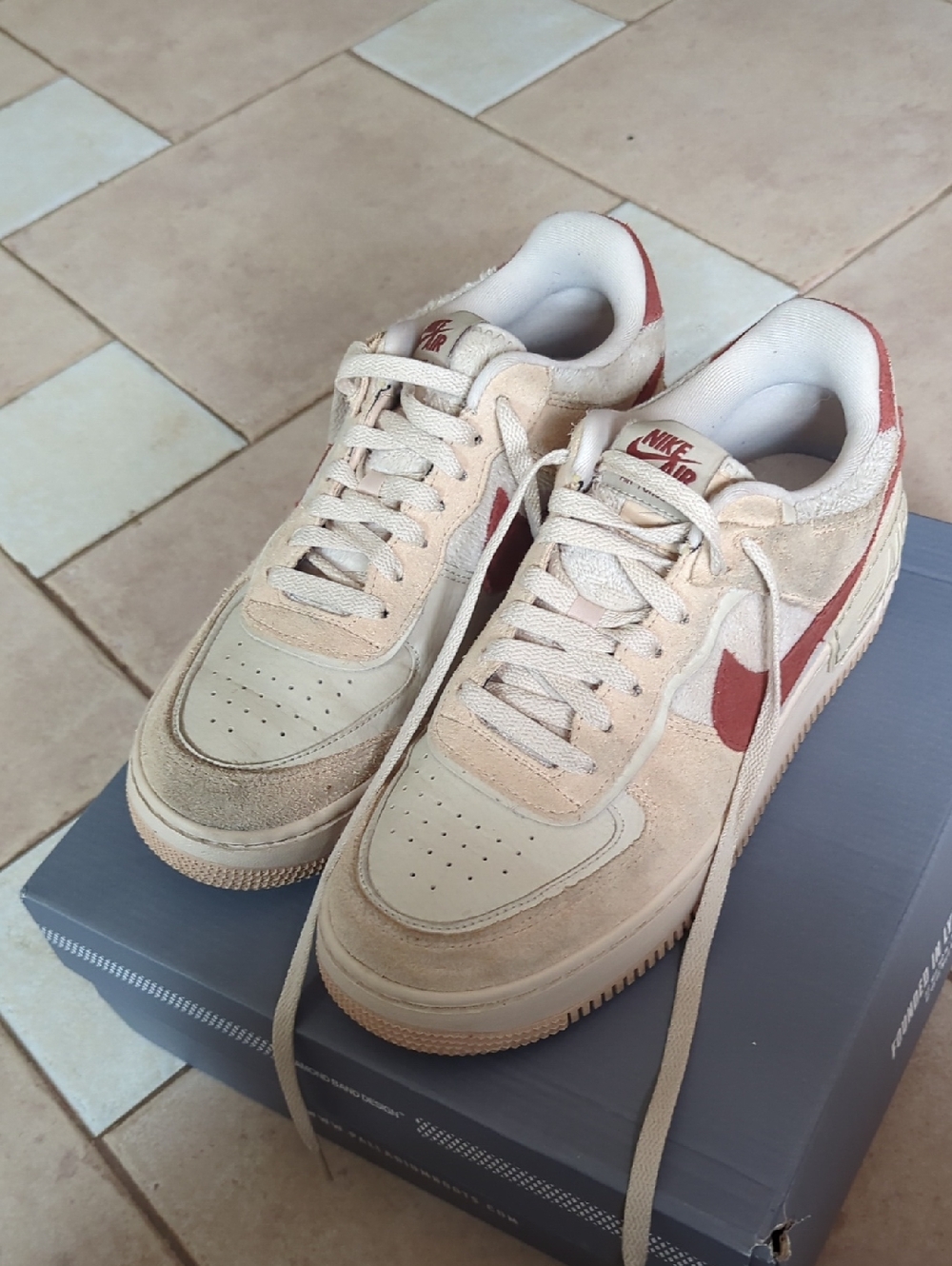 Nike Low-Top Sneakers in Cream and Red Swoosh